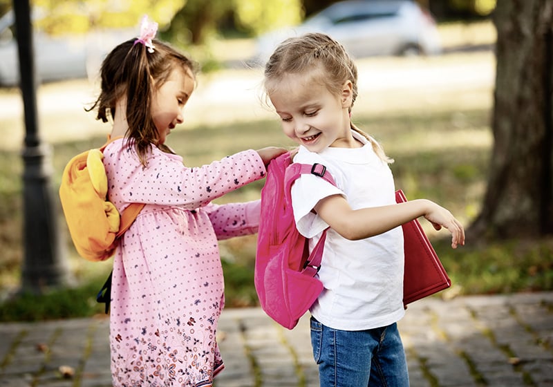 Two_girls_backpack_primaryschool